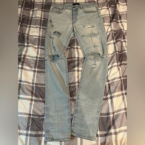 AMIRI Faded Blue Ripped Slim Jeans